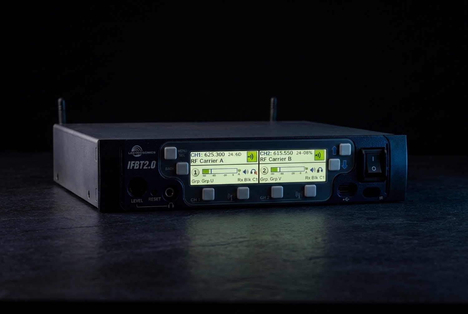 Lectrosonics IFBT2.0 interruptible foldback base station transmitter in dark cinematic studio lighting
