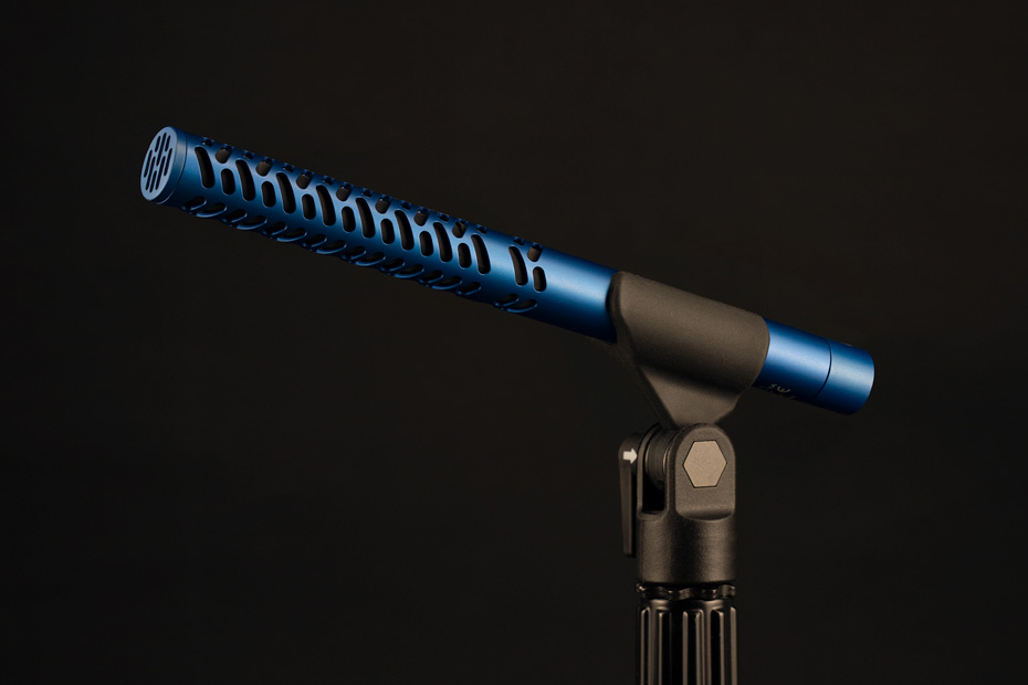 The Lectrosonics S1 shotgun microphone, blue anodized body on a dark background